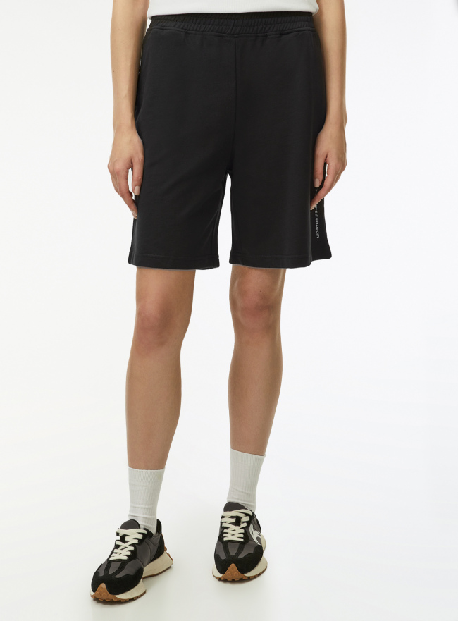 Шорты свободного силуэта из хлопка oodji для Женщины (черный) Шорты свободного силуэта из хлопка oodji для Женщины (черный), 17001111/47648N/2900P